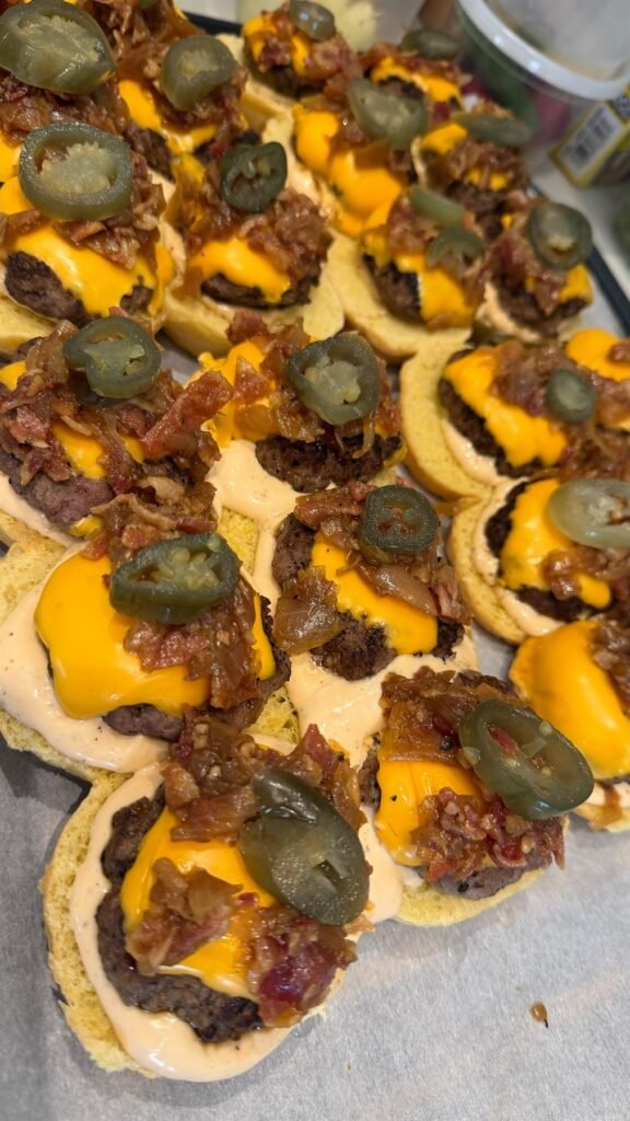 Canapé tartlets topped with olives and roasted pepper