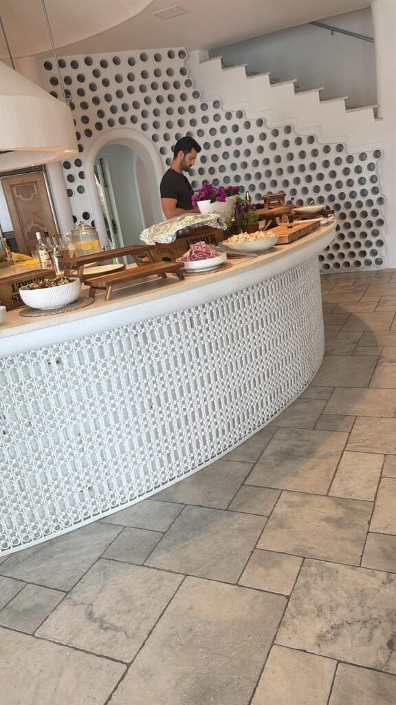 Catering platters set up along a white kitchen island