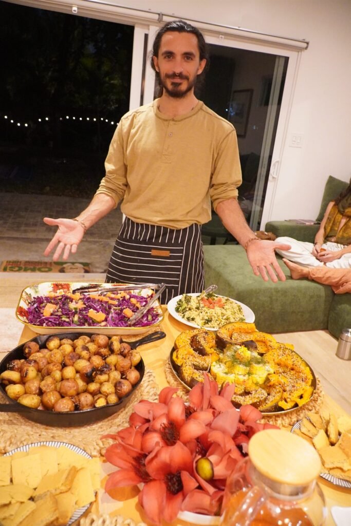 Chef presenting a completed buffet spread
