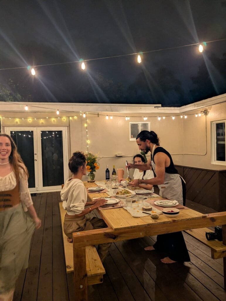Guests seated for dinner on a covered terrace