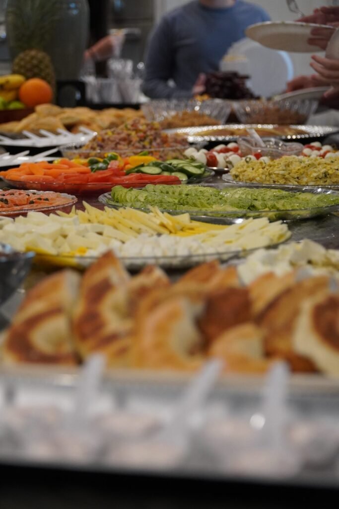 Close detail of a grazing board with breads, dips and fresh produce