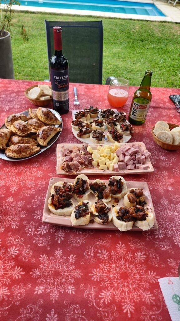 Holiday appetiser table with platters of canapés and wine