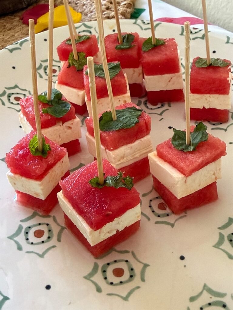 Watermelon and feta skewers garnished with fresh mint